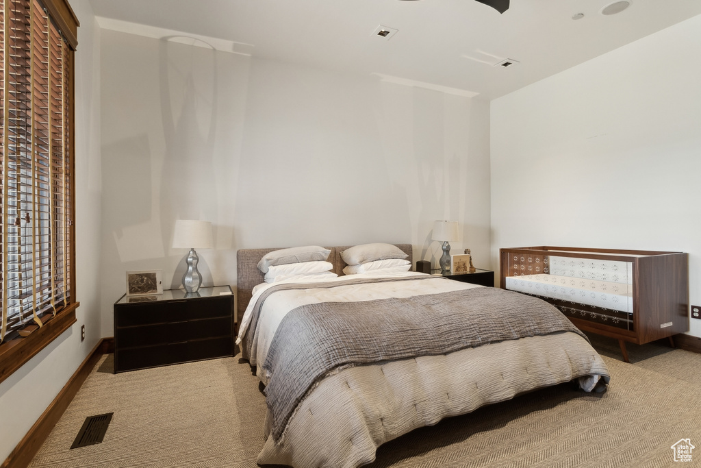 Carpeted bedroom with baseboards