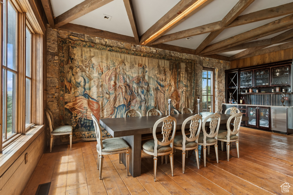 Dining area with hardwood / wood-style floors