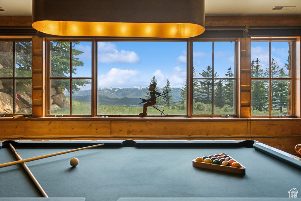 Recreation room with billiards table and healthy amount of natural light