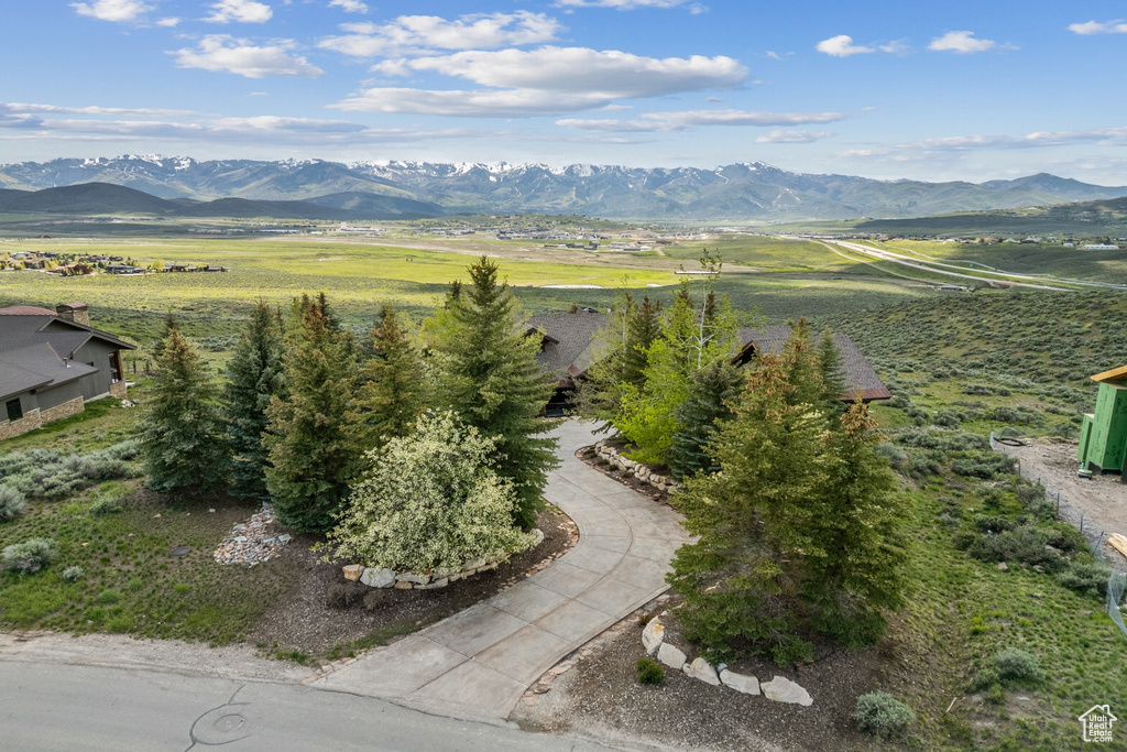 View of mountain backdrop featuring rural landscape