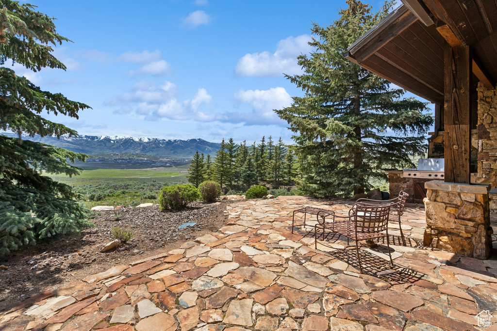 View of patio with a mountain view