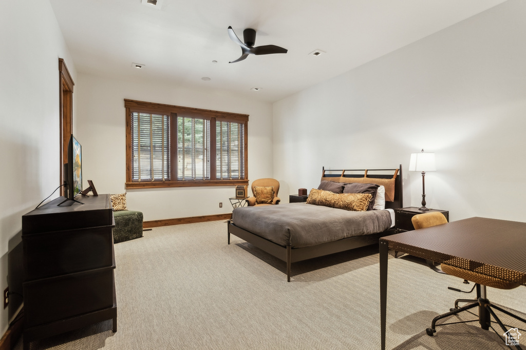 Carpeted bedroom with baseboards