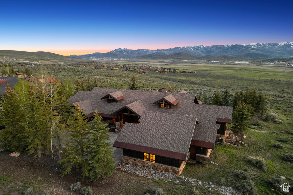 View of subject property with a mountainous background