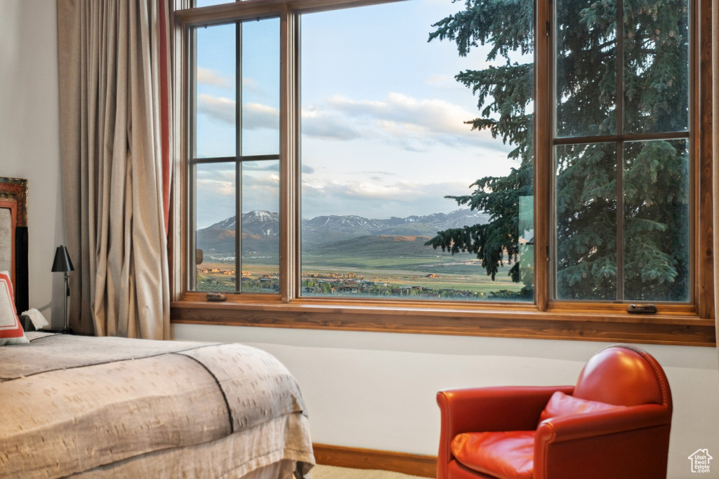 Bedroom featuring a mountain view and carpet
