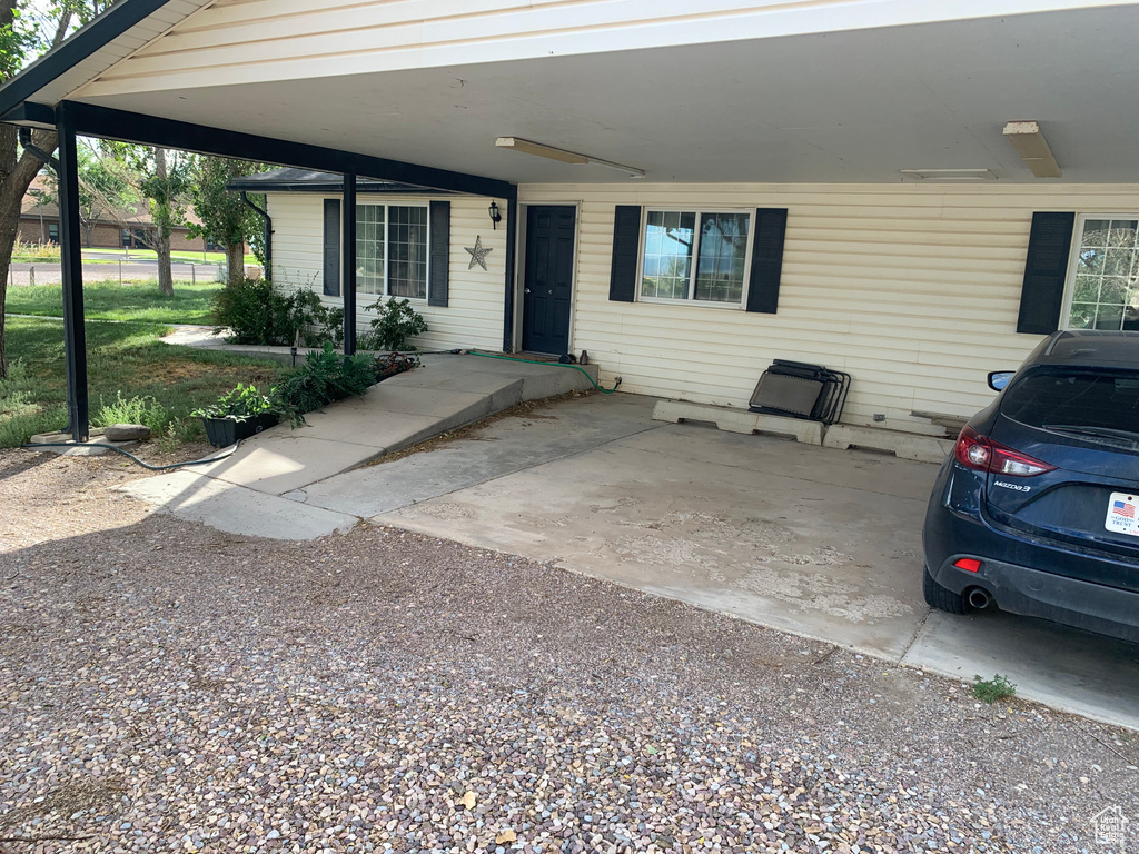 View of patio with a carport