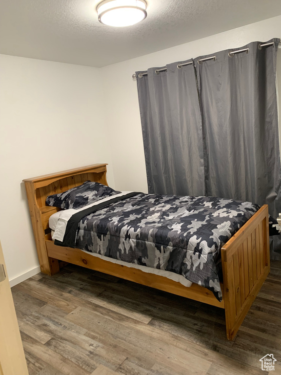 Bedroom featuring wood finished floors
