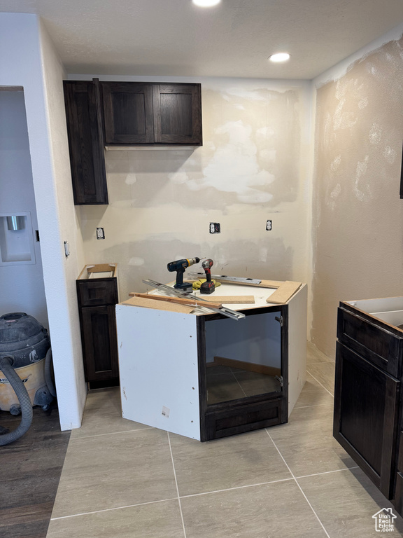 Kitchen with dark brown cabinets