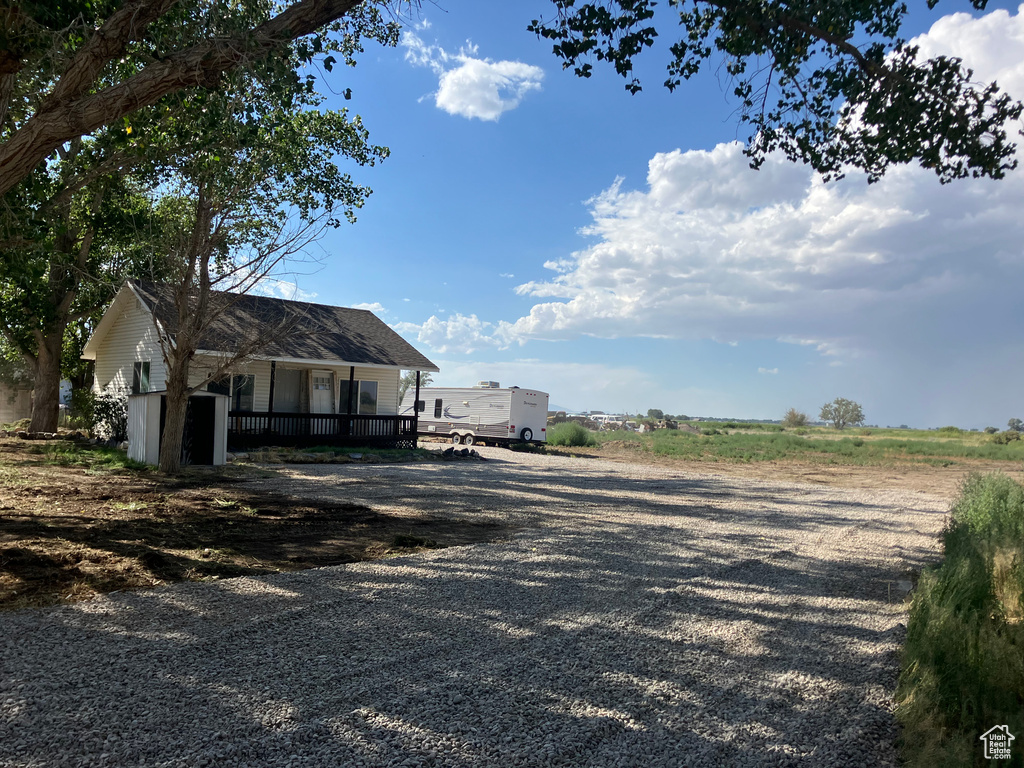 View of yard featuring covered porch