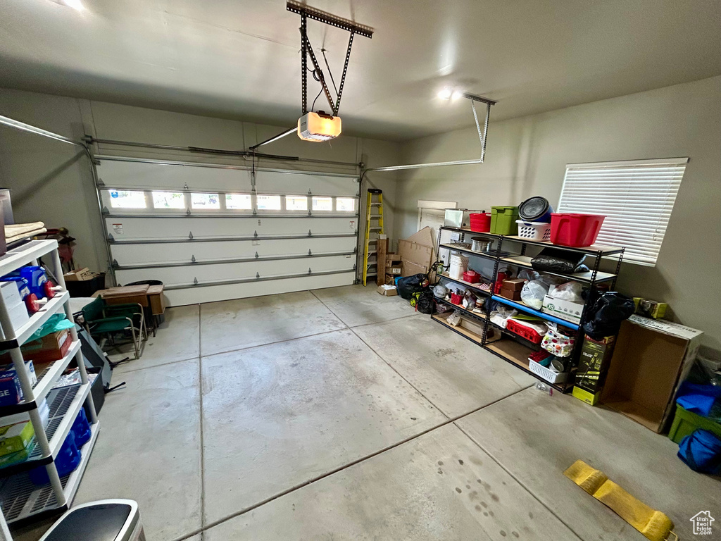 Garage featuring a garage door opener