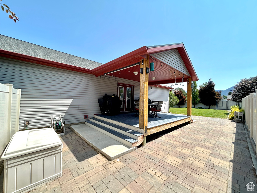 View of patio featuring french doors and a wooden deck