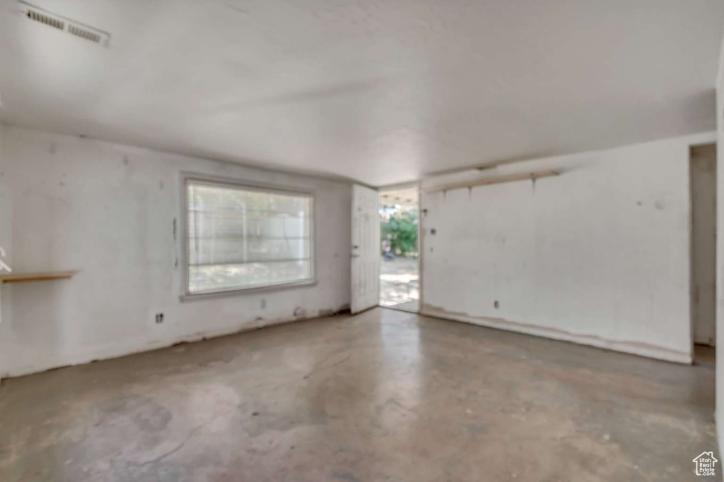 Unfurnished room with concrete floors