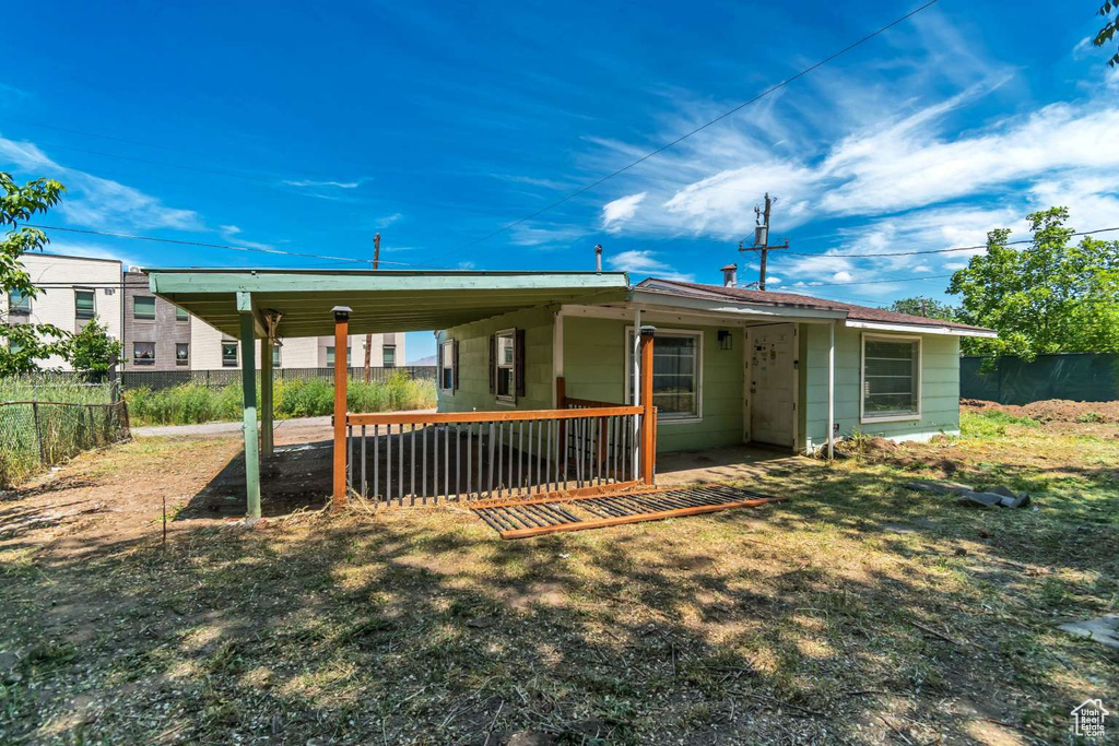 Rear view of house with a carport