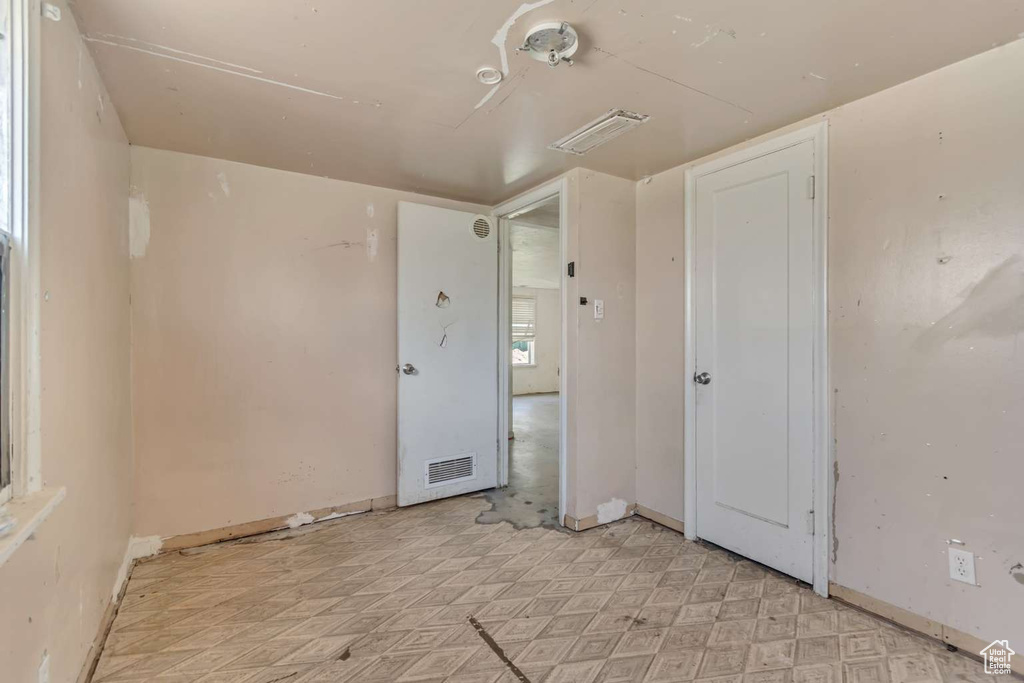 Spare room featuring baseboards