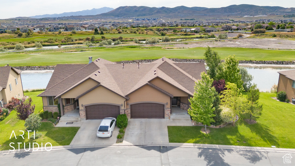 View of subject property featuring a local golf course and a water and mountain view