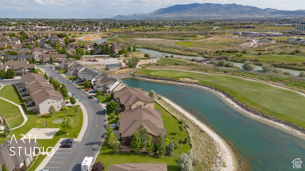 Aerial perspective of suburban area featuring a water and mountain view and a golf course
