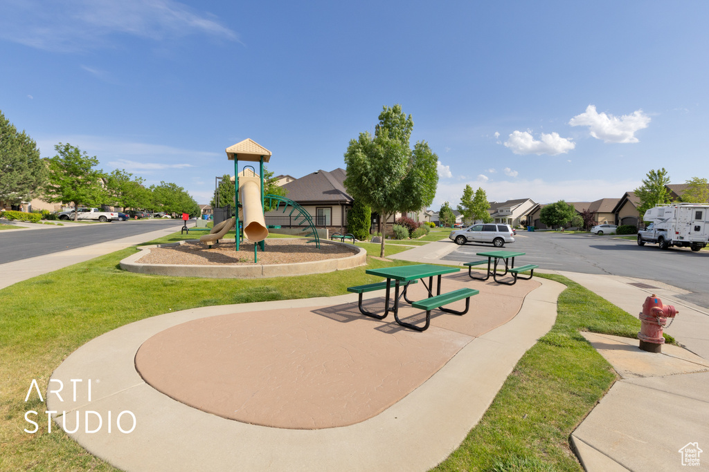 View of community featuring a yard and a residential view