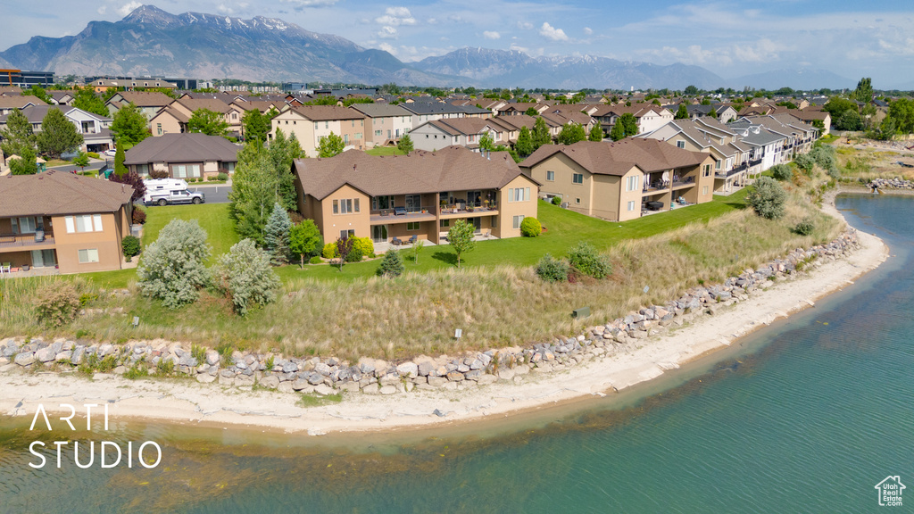 Aerial view of residential area featuring a water and mountain view