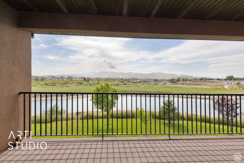 Deck featuring a water and mountain view