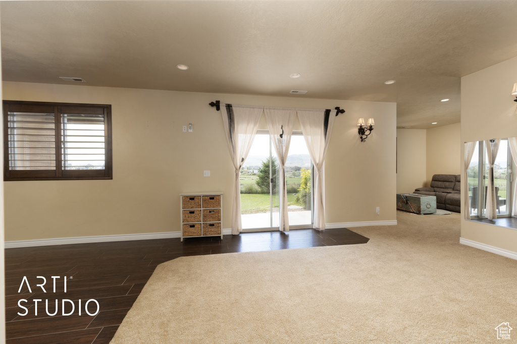 Living room with recessed lighting, baseboards, and wood finished floors