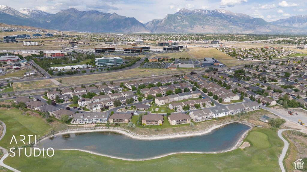 Aerial overview of property\\\\\\\\\\\\\\\'s location with a water and mountain view, nearby suburban area, and a local golf course
