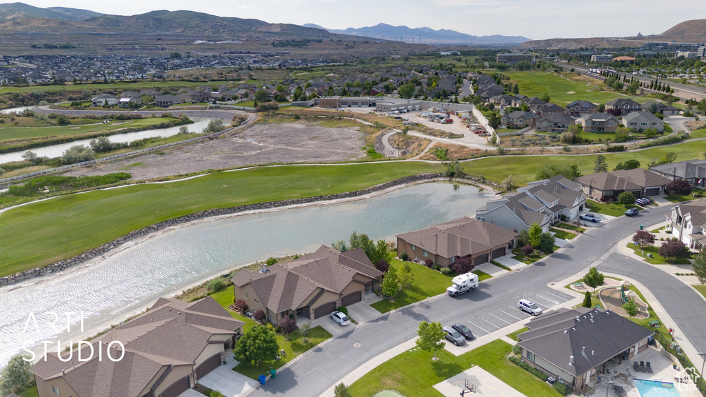 Aerial perspective of suburban area featuring a water and mountain view