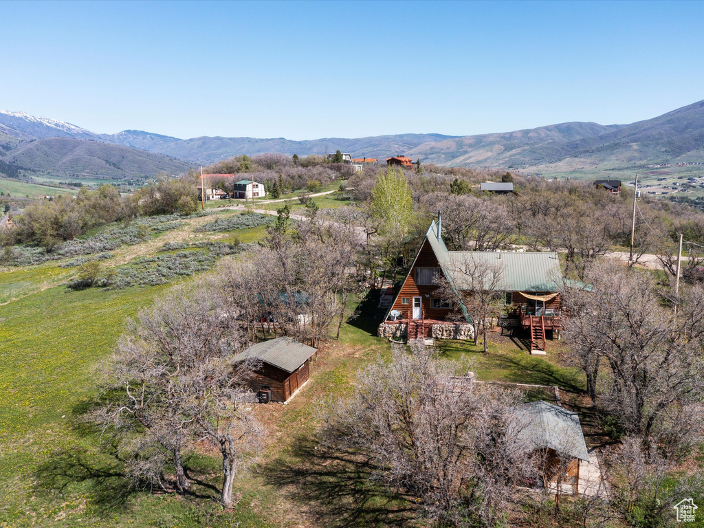 View of subject property with mountains
