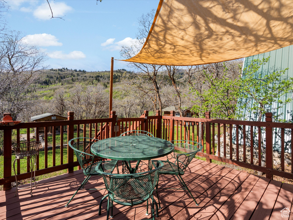 Wooden terrace with outdoor dining area
