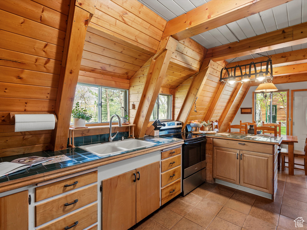 Kitchen with electric range, a sink, tile countertops, wooden ceiling, and a peninsula