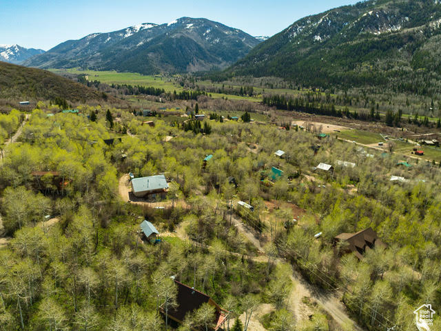 View of mountain backdrop featuring rural landscape
