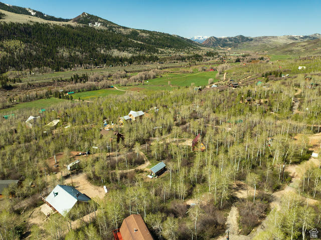 View of mountain backdrop with rural landscape