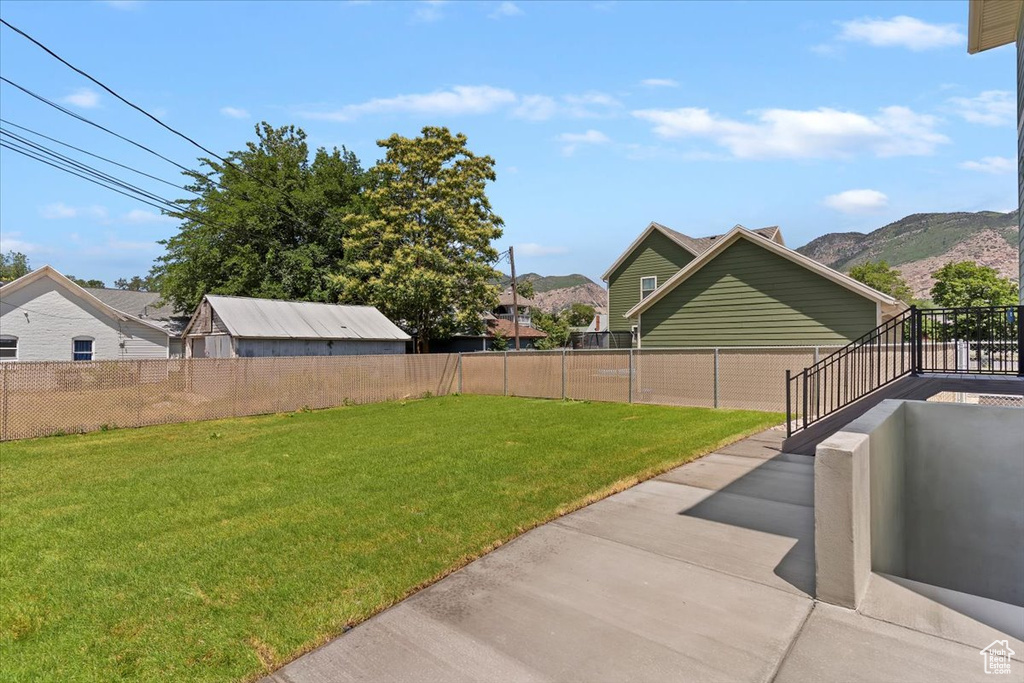 View of yard with a patio area and a mountain view