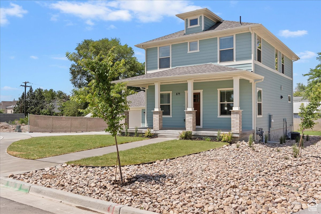 Traditional style home with covered porch and cooling unit