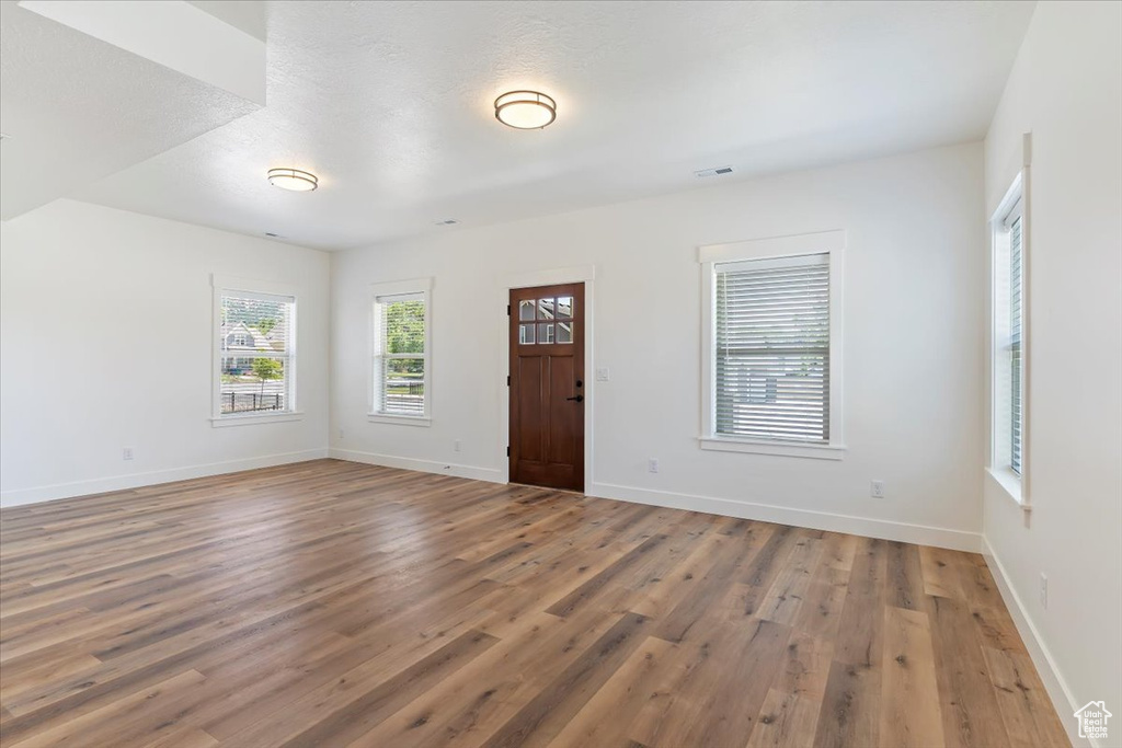 Entryway featuring wood finished floors and baseboards