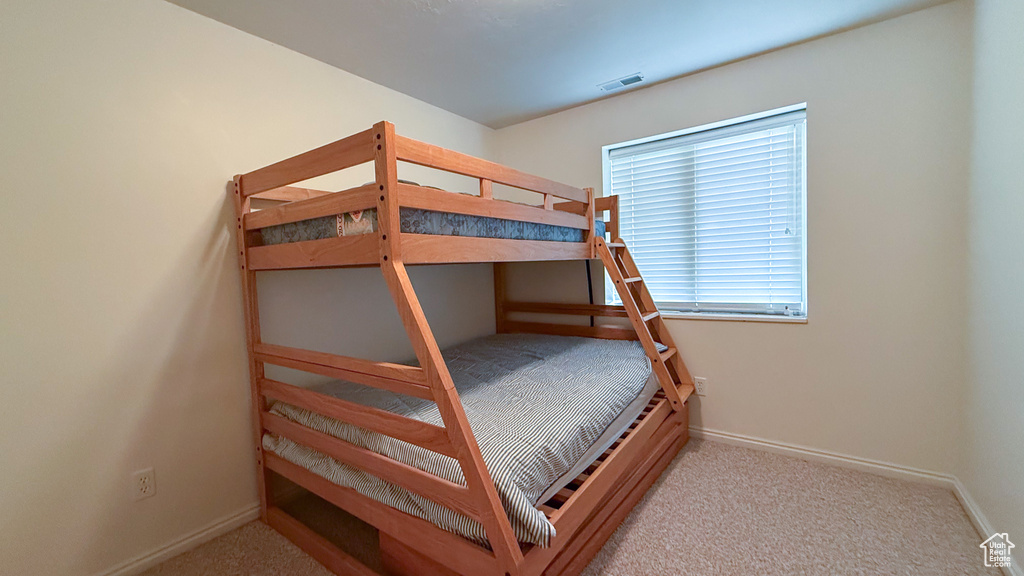 Carpeted bedroom with baseboards