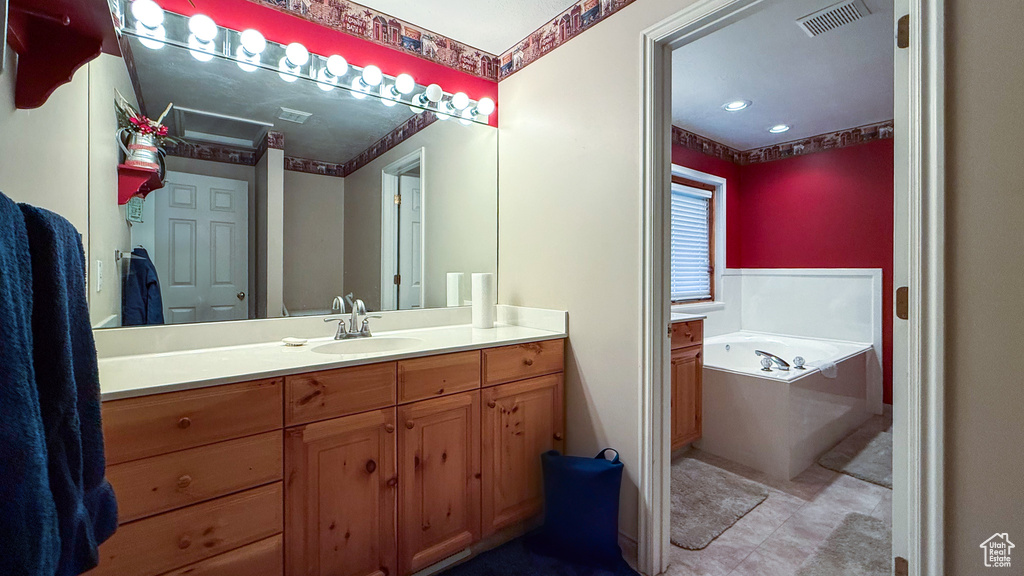 Full bathroom with a bath and vanity