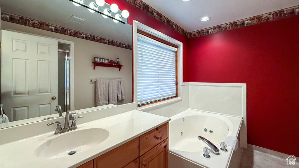 Full bathroom featuring a whirlpool tub, vanity, recessed lighting, an enclosed shower, and tile patterned floors