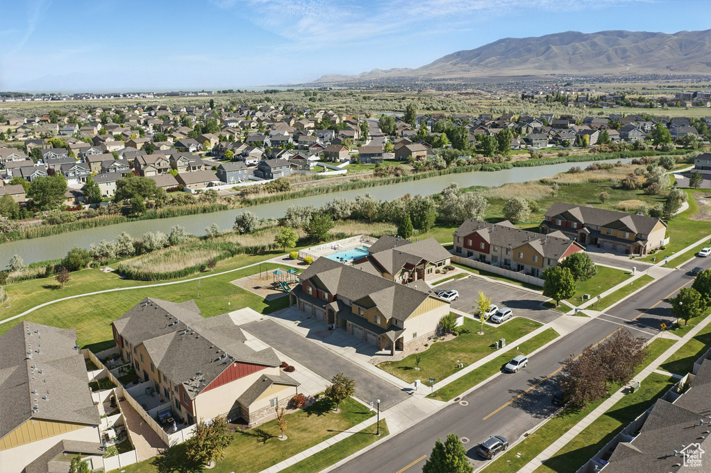 Aerial overview of property's location with nearby suburban area and a water and mountain view