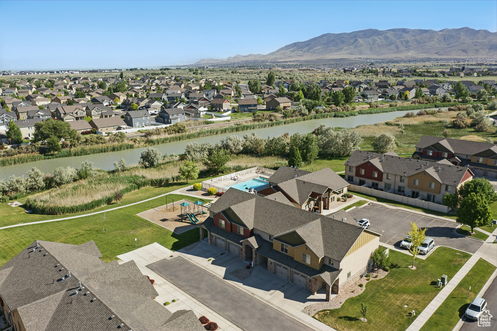 Aerial view of residential area featuring a water and mountain view