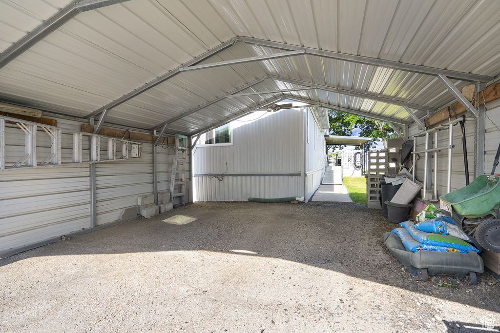 Garage featuring a carport