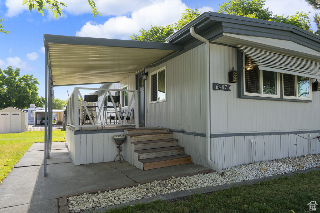View of front of home featuring a front lawn and a patio area