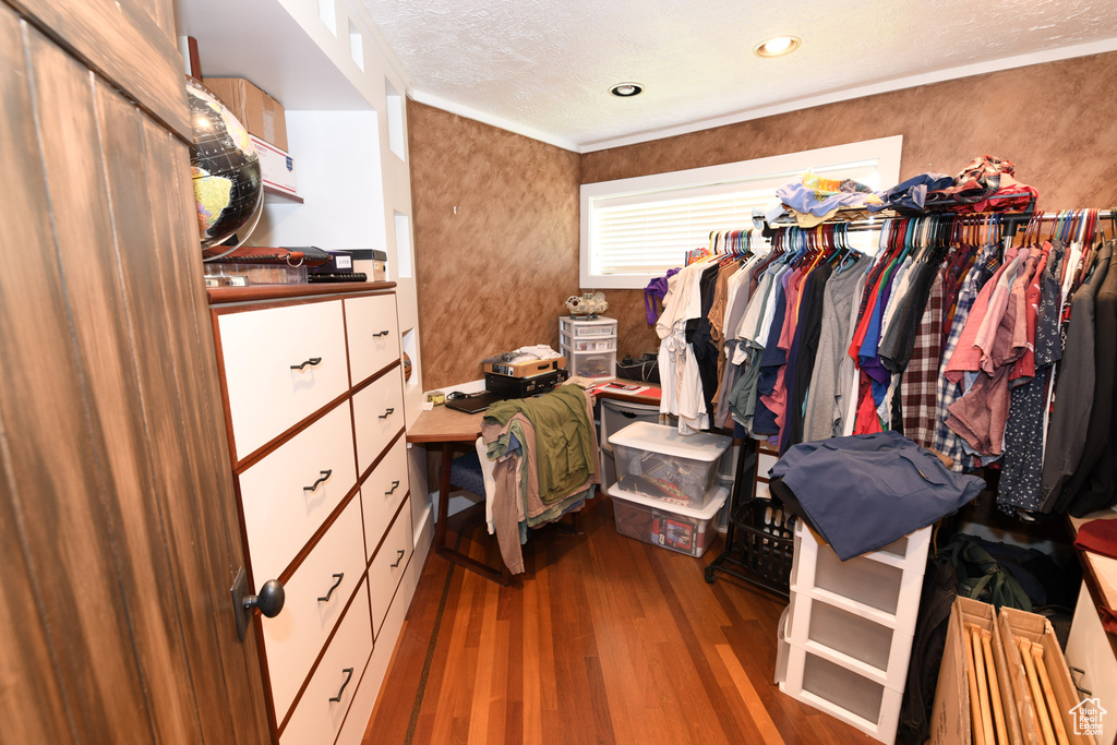 Spacious closet featuring wood finished floors