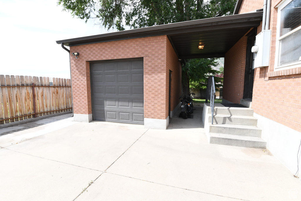 Garage featuring driveway