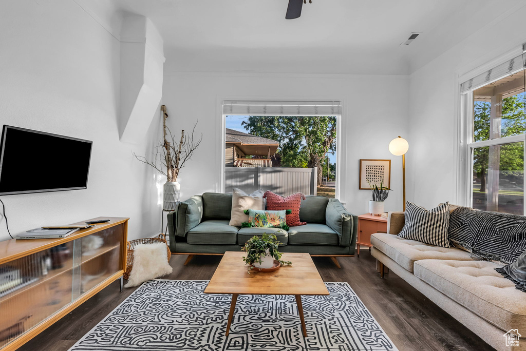 Living room with wood finished floors and ceiling fan