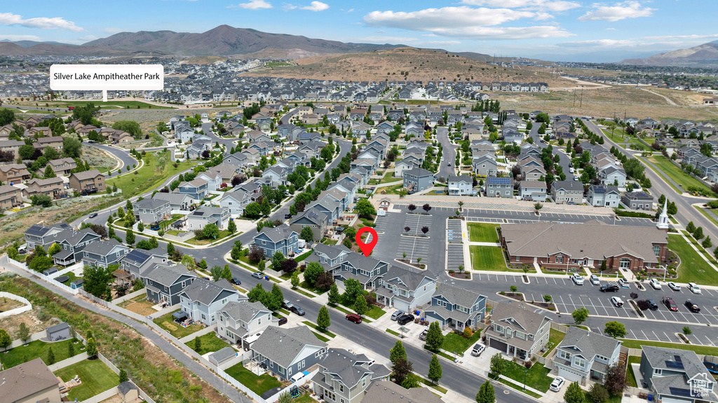View of property location with mountains and nearby suburban area
