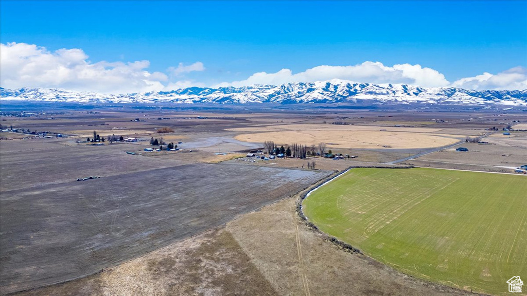 Aerial view of sparsely populated area featuring a mountainous background