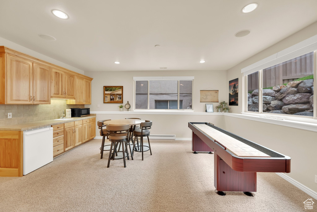 Rec room with recessed lighting, light carpet, a sink, baseboards, and billiards