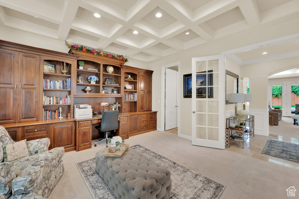 Office space featuring light colored carpet, built in study area, recessed lighting, french doors, and coffered ceiling