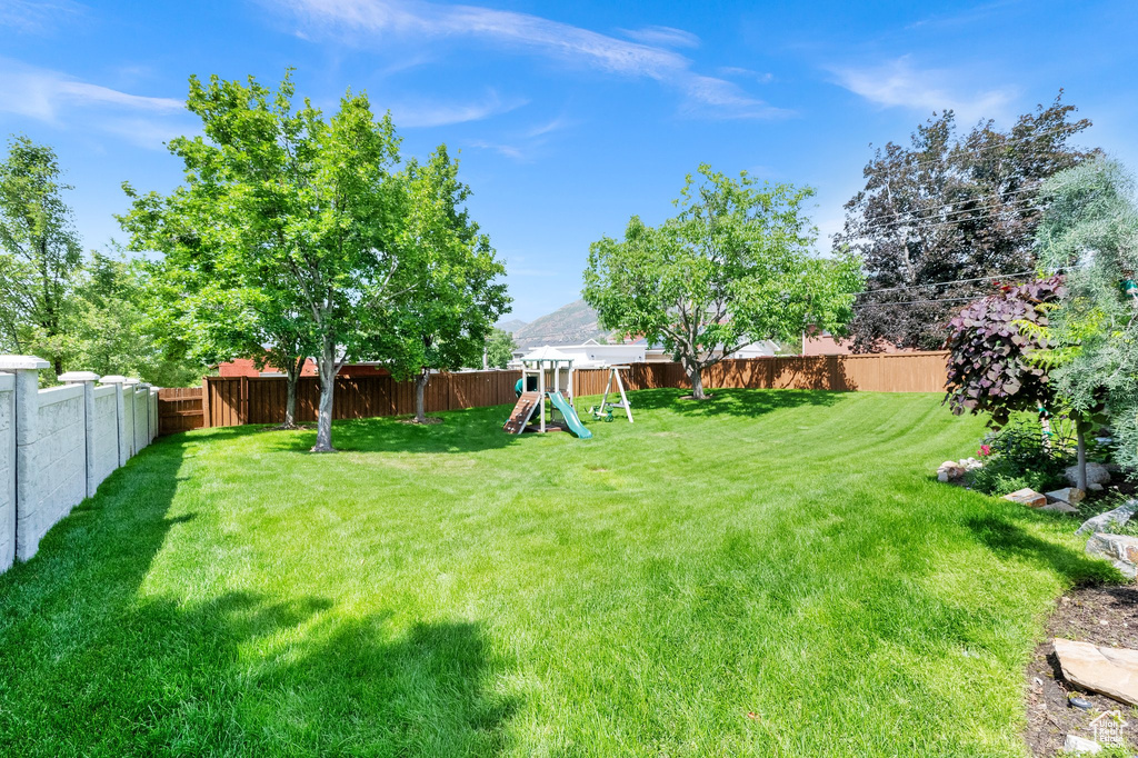 View of yard with a playground