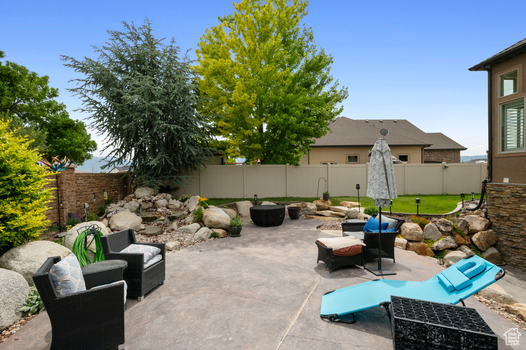 Fenced backyard with a patio area
