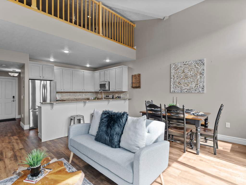 Living room with wood finished floors and baseboards